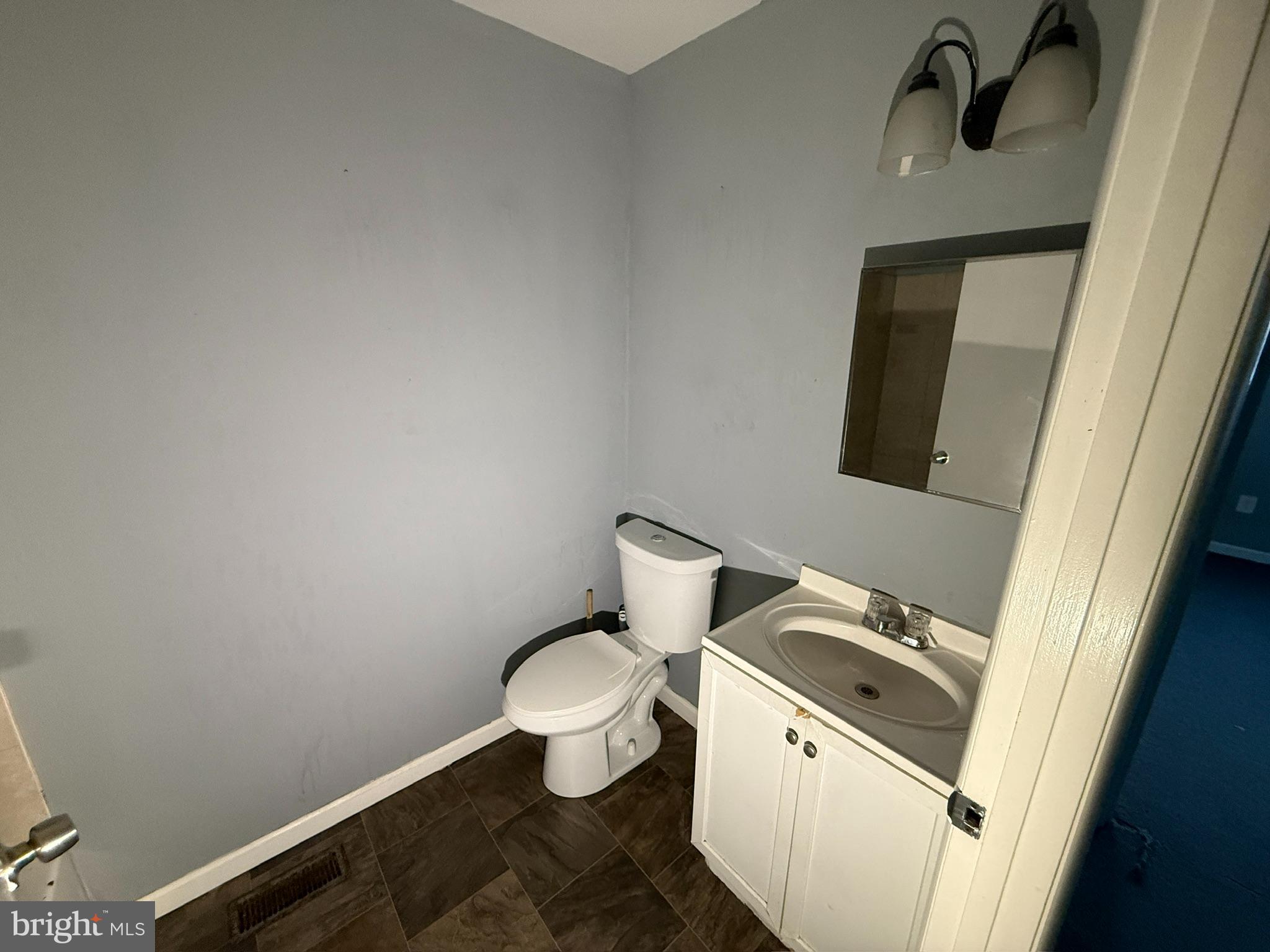 117 North Janney Street Baltimore, MD 21224 - Photo 8 of 13 a bathroom with a toilet and a sink