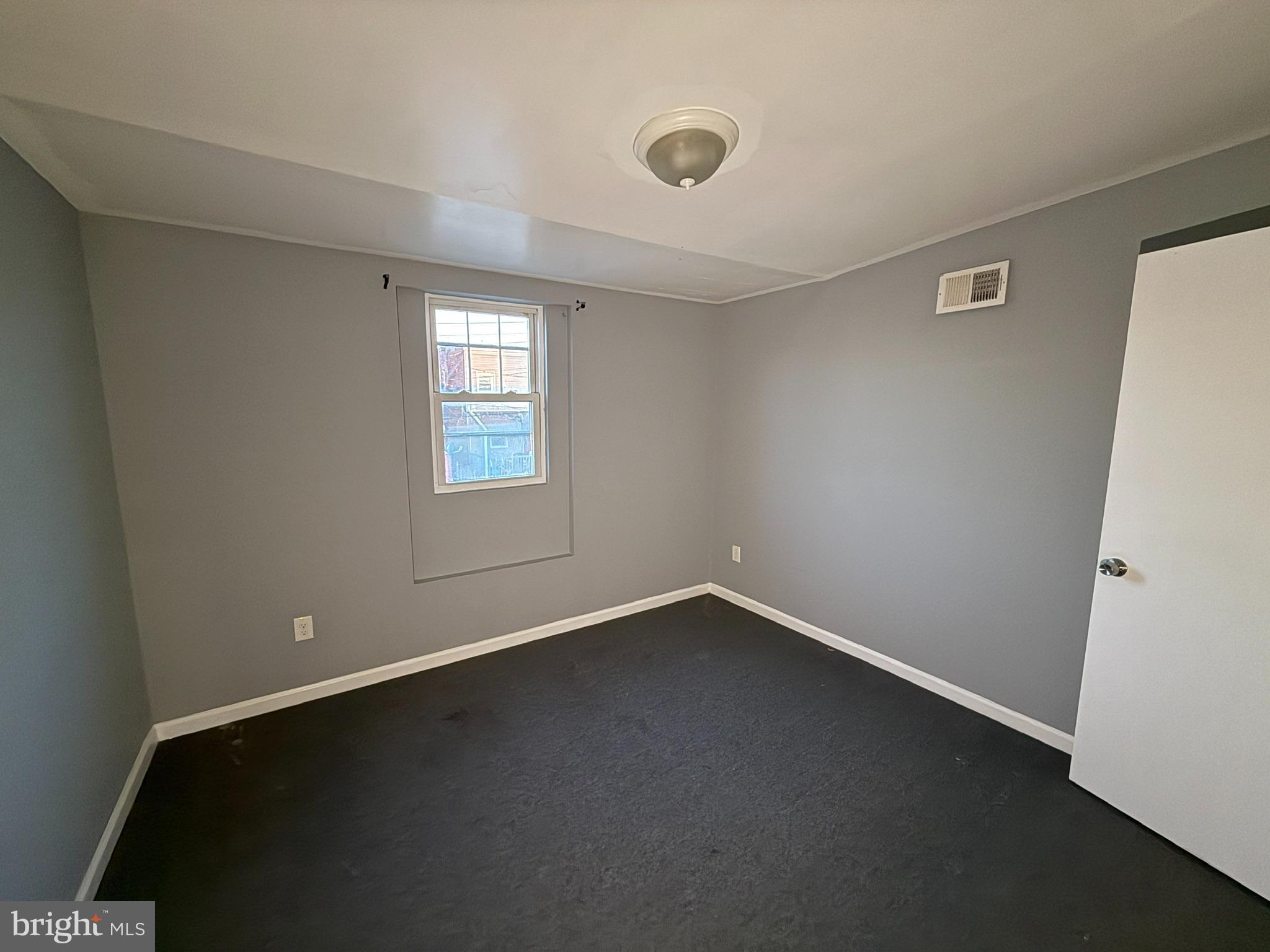 117 North Janney Street Baltimore, MD 21224 - Photo 10 of 13 an empty room with a window