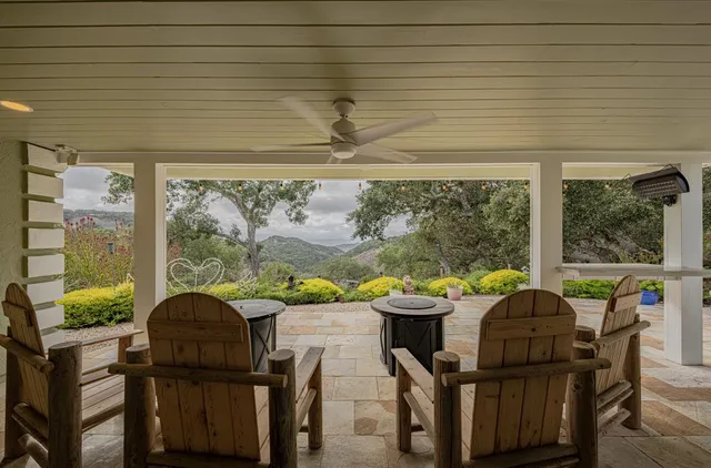 a bathroom with a sink mirror and vanity