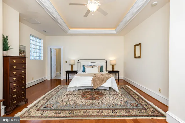 a bedroom with furniture and wooden floor