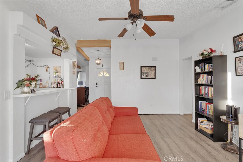 13167 Olathe Road Apple Valley, CA 92308 - Photo 12 of 40 a bed room with a bed and a book shelf