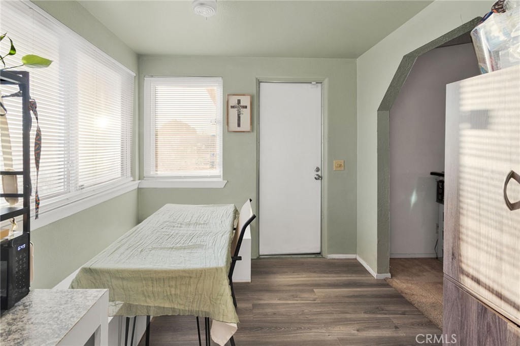 13167 Olathe Road Apple Valley, CA 92308 - Photo 14 of 40 a view of a dining room with furniture and wooden floor