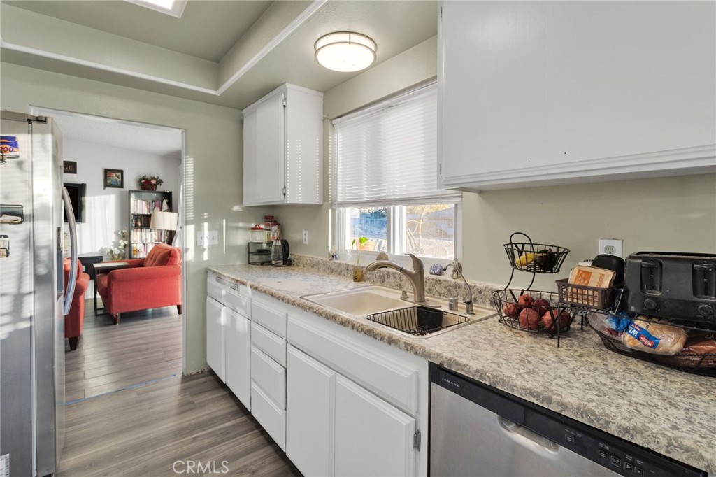 13167 Olathe Road Apple Valley, CA 92308 - Photo 17 of 40 a kitchen with sink and cabinets