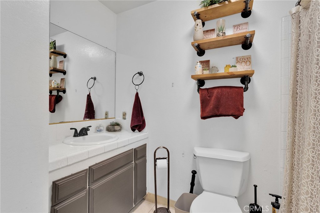 13167 Olathe Road Apple Valley, CA 92308 - Photo 20 of 40 a bathroom with a sink and a mirror