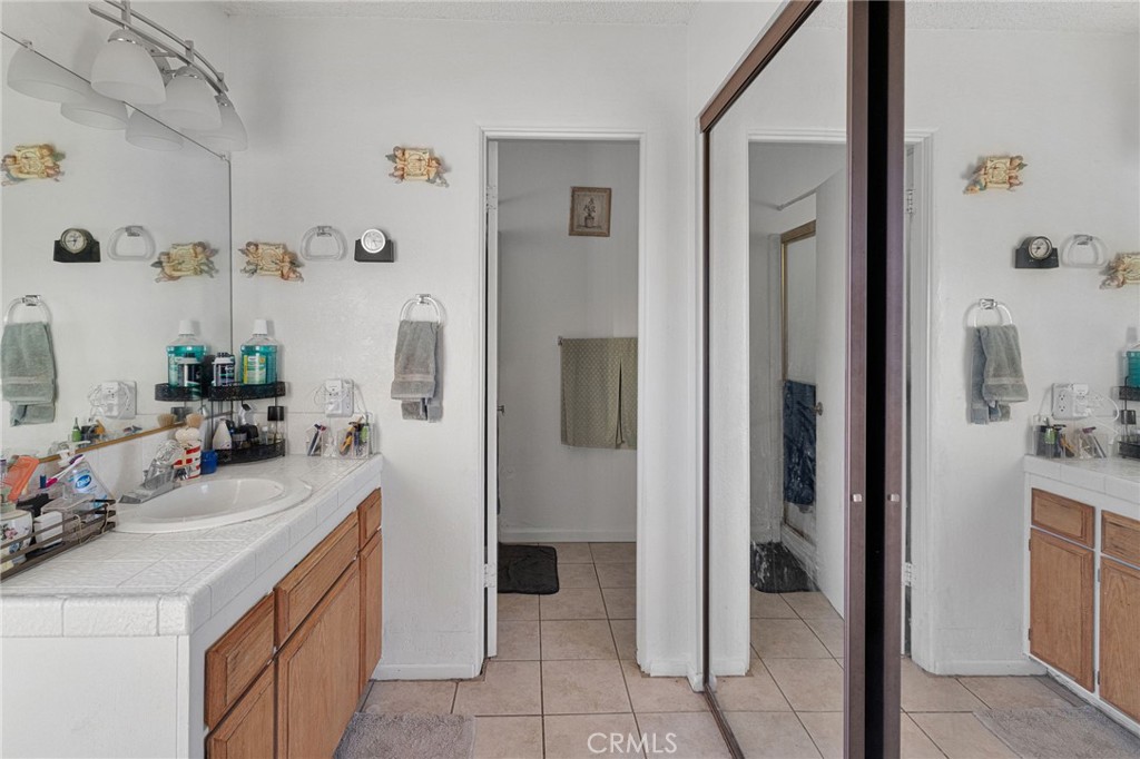 13167 Olathe Road Apple Valley, CA 92308 - Photo 30 of 40 a bathroom with a sink a toilet and shower