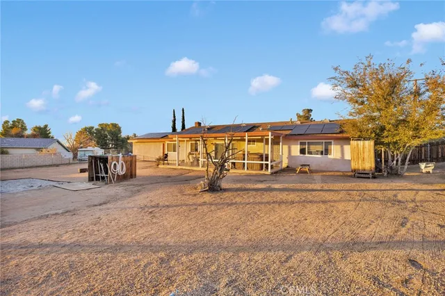a view of a house with outdoor space and sitting area