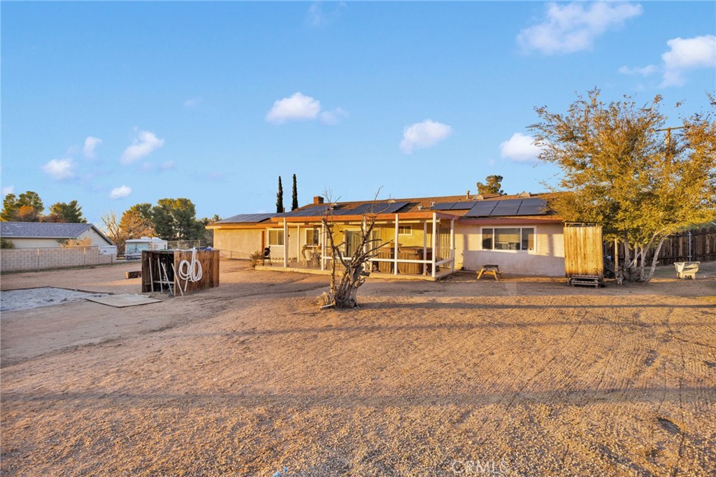 13167 Olathe Road Apple Valley, CA 92308 - Photo 37 of 40 a view of a house with outdoor space and sitting area