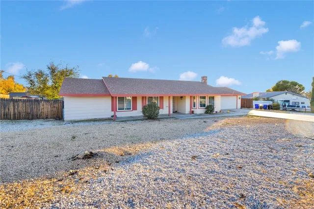 a view of a house with a yard and garage