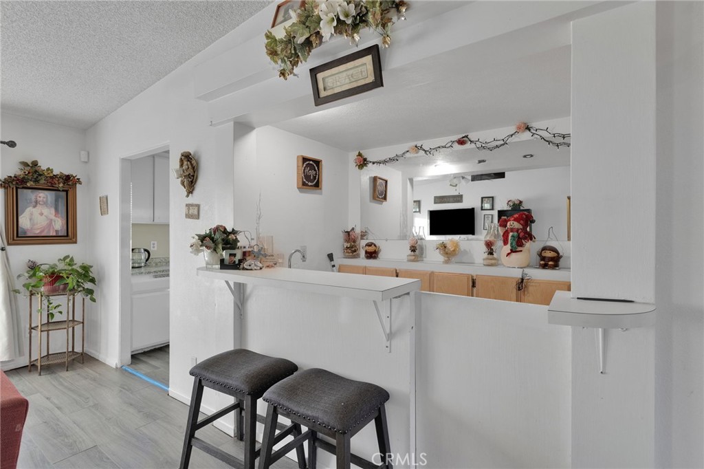 13167 Olathe Road Apple Valley, CA 92308 - Photo 10 of 40 a living room with furniture and a flat screen tv