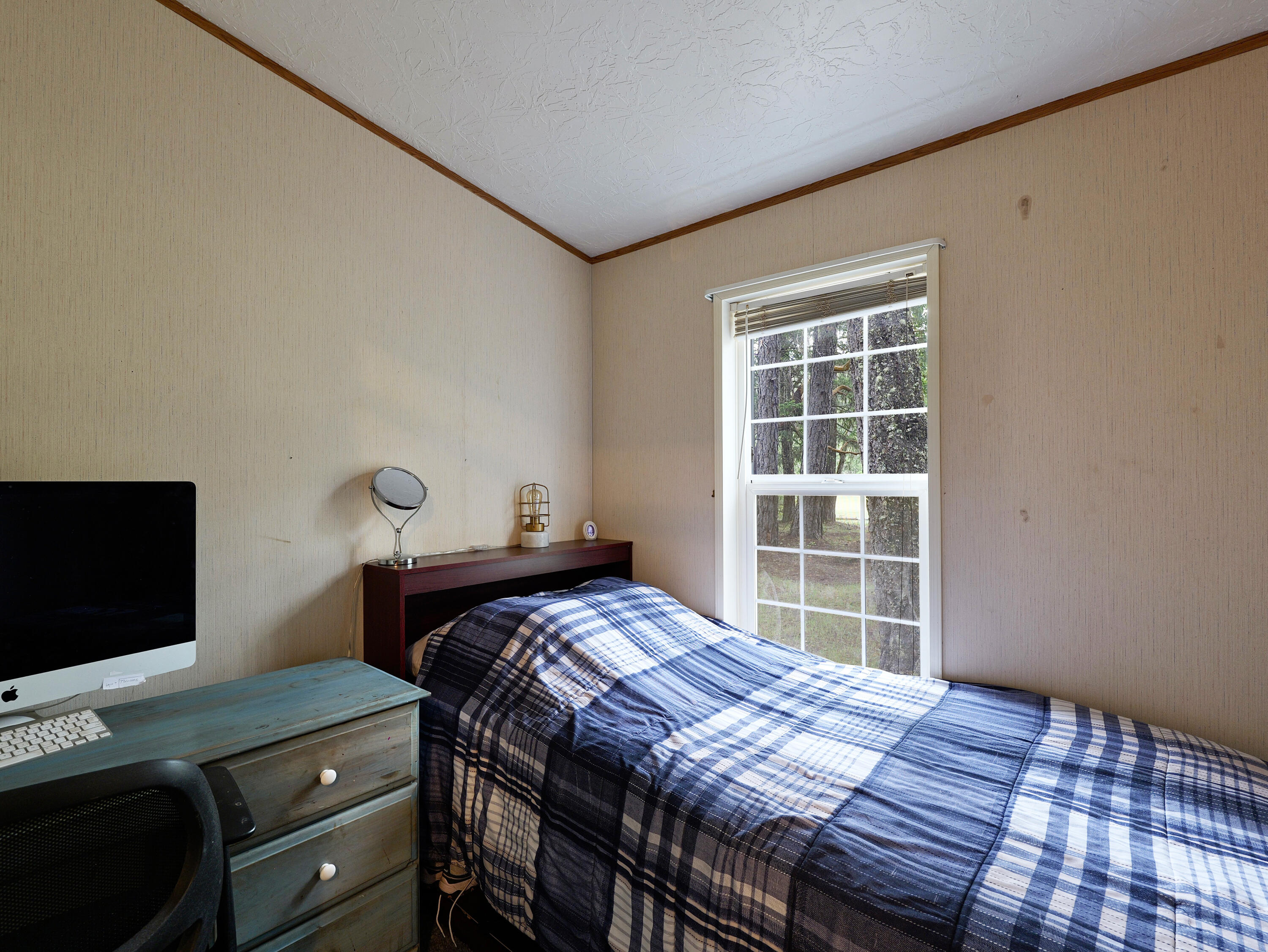 42256 Highway 62 Prospect, OR 97536 - Photo 12 of 48 a bedroom with a bed and a window