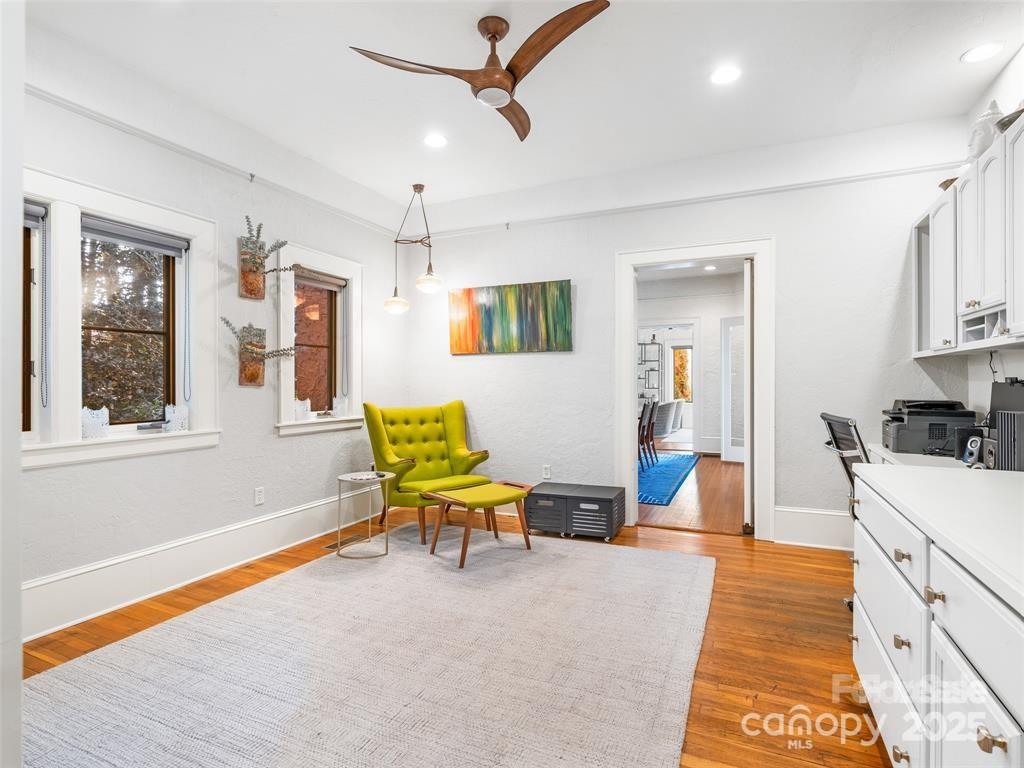 26 Sheridan Road Asheville, NC 28803 - Photo 17 of 46 a living room with stainless steel appliances furniture a flat screen tv and windows