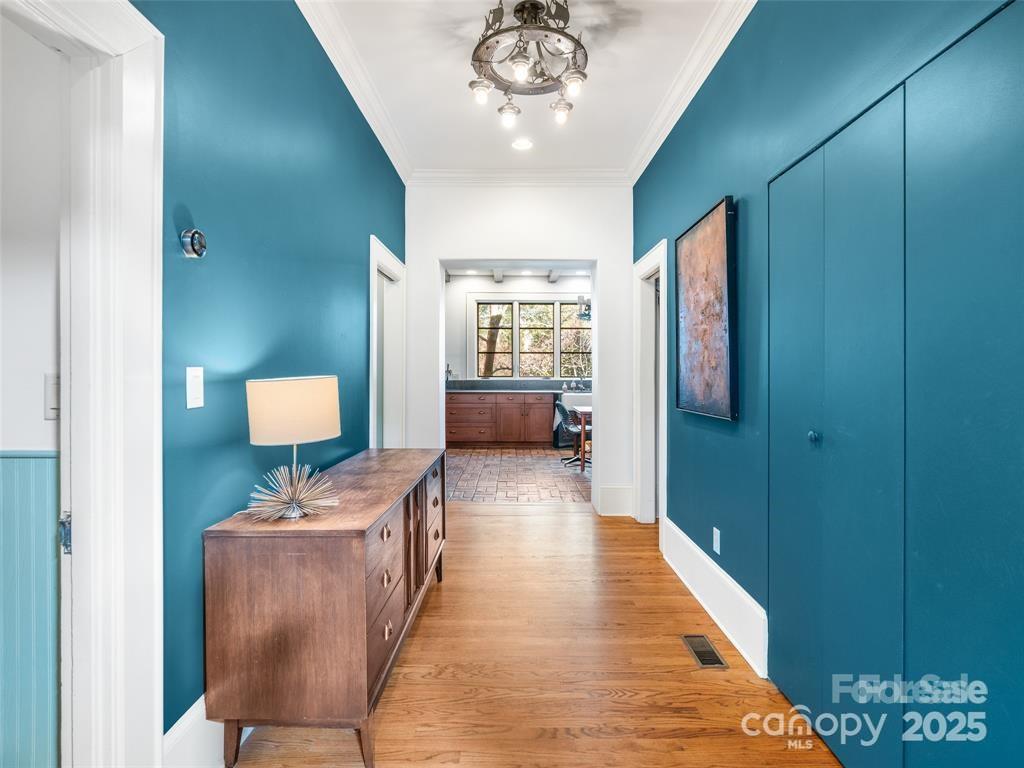 26 Sheridan Road Asheville, NC 28803 - Photo 19 of 46 a view of hallway with furniture and a chandelier