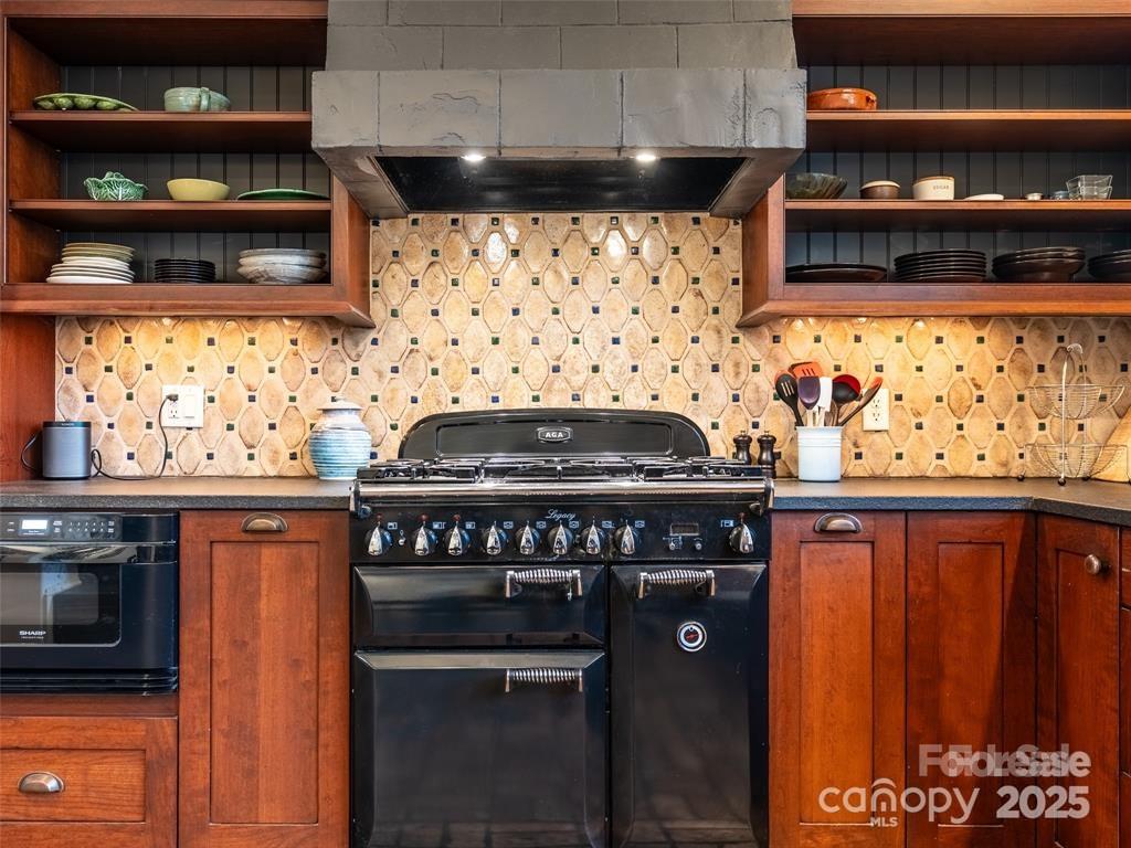 26 Sheridan Road Asheville, NC 28803 - Photo 25 of 46 a kitchen with stainless steel appliances a stove and a refrigerator