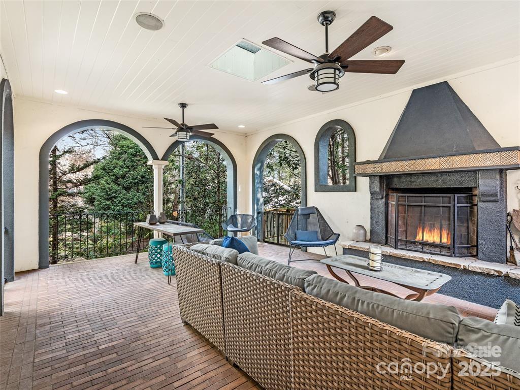26 Sheridan Road Asheville, NC 28803 - Photo 26 of 46 a living room with fireplace furniture and a large window