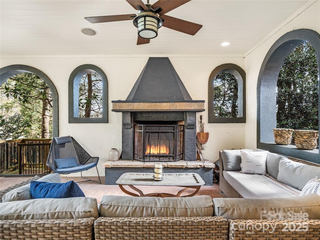 26 Sheridan Road Asheville, NC 28803 - Photo 27 of 46 a living room with furniture and a fireplace