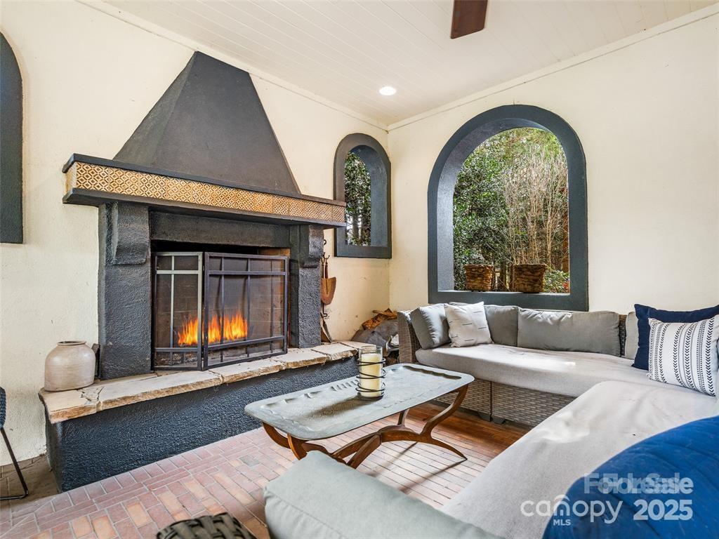 26 Sheridan Road Asheville, NC 28803 - Photo 28 of 46 a living room with furniture and a fireplace