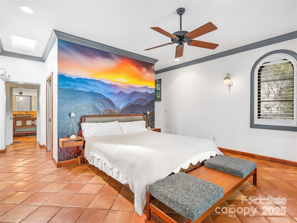 26 Sheridan Road Asheville, NC 28803 - Photo 31 of 46 a bedroom with a bed and window