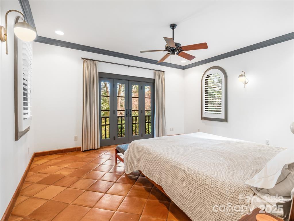26 Sheridan Road Asheville, NC 28803 - Photo 32 of 46 a bedroom with a bed dresser and a window