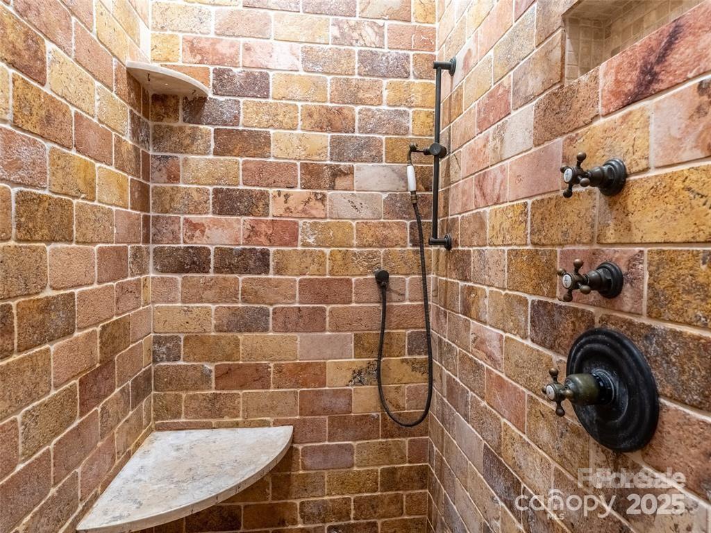 26 Sheridan Road Asheville, NC 28803 - Photo 36 of 46 a bathroom with a sink and a shower