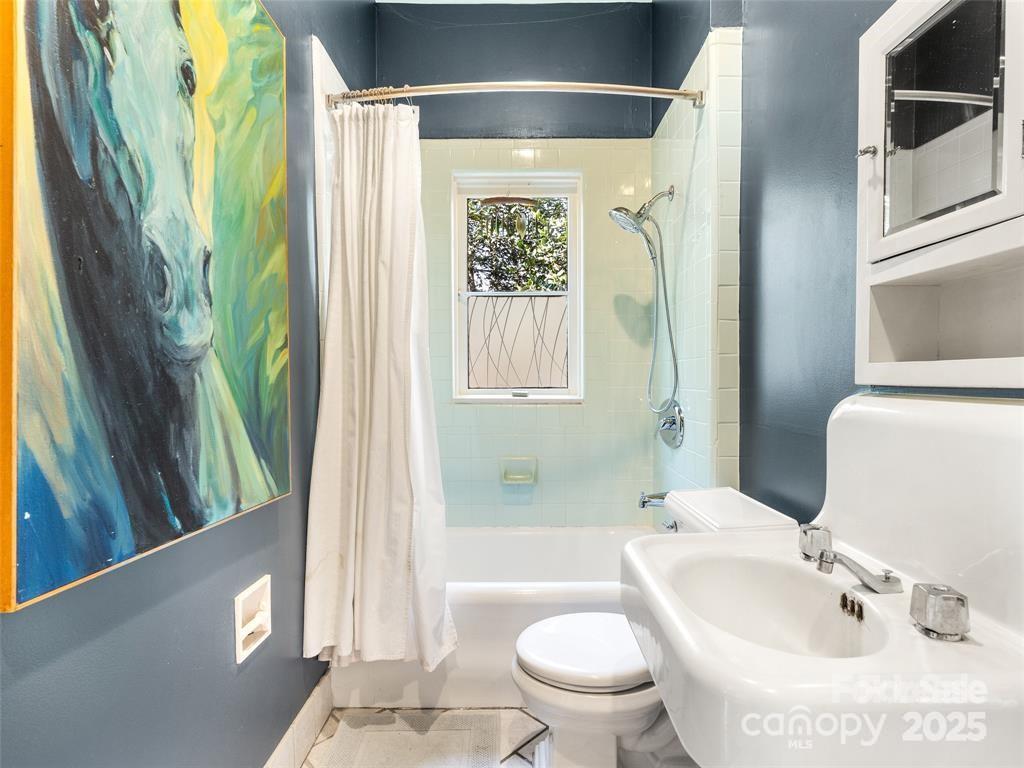 26 Sheridan Road Asheville, NC 28803 - Photo 39 of 46 a bathroom with a sink toilet and shower