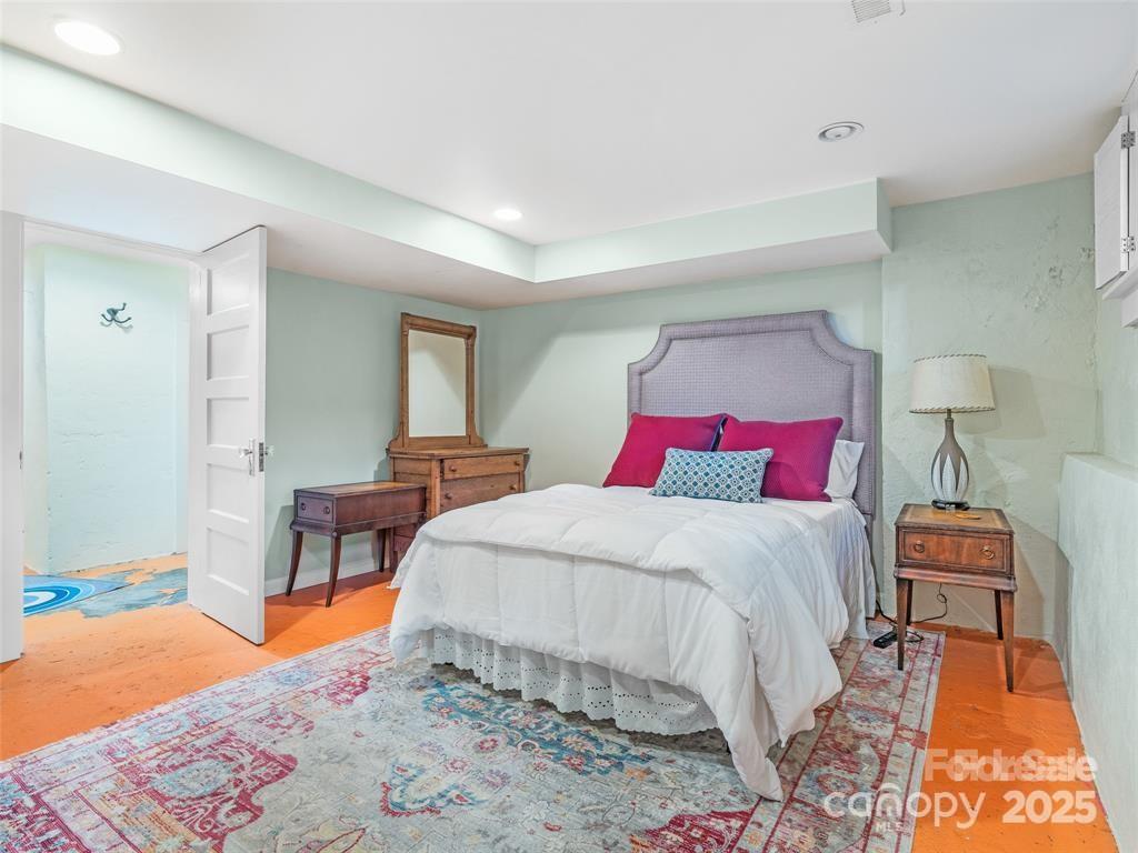 26 Sheridan Road Asheville, NC 28803 - Photo 40 of 46 a bedroom with bed and chair