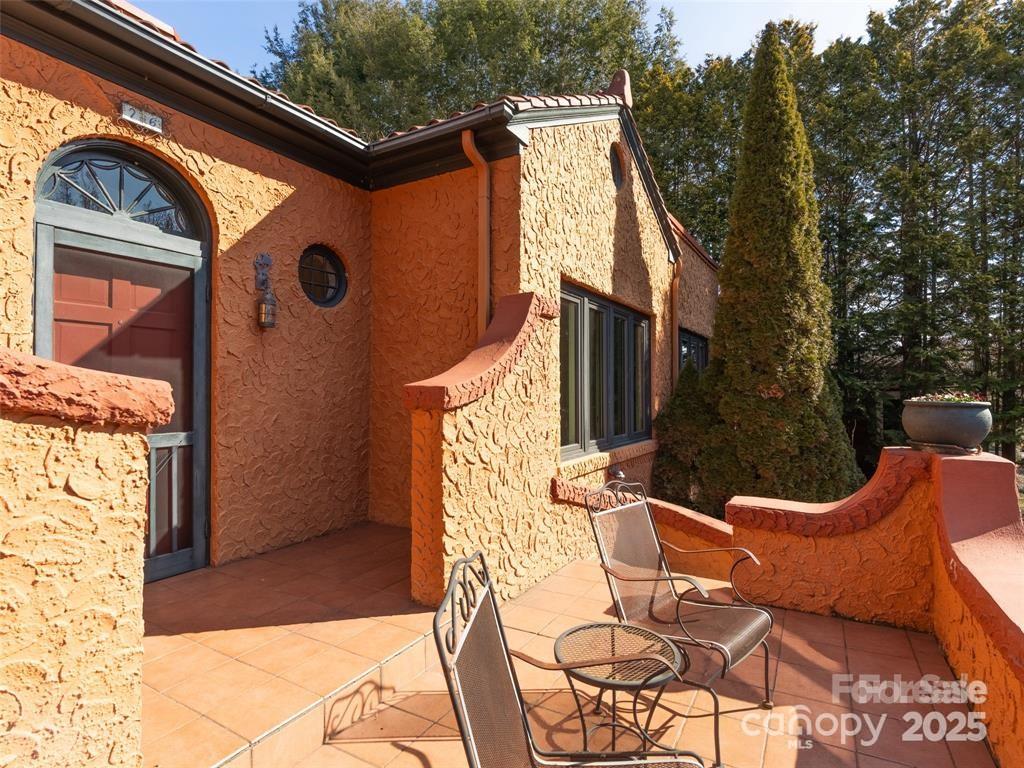 26 Sheridan Road Asheville, NC 28803 - Photo 5 of 46 a view of a two chair in the balcony