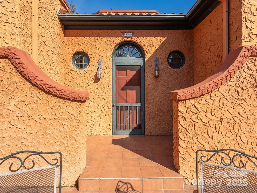 26 Sheridan Road Asheville, NC 28803 - Photo 7 of 46 a front view of a house with a door