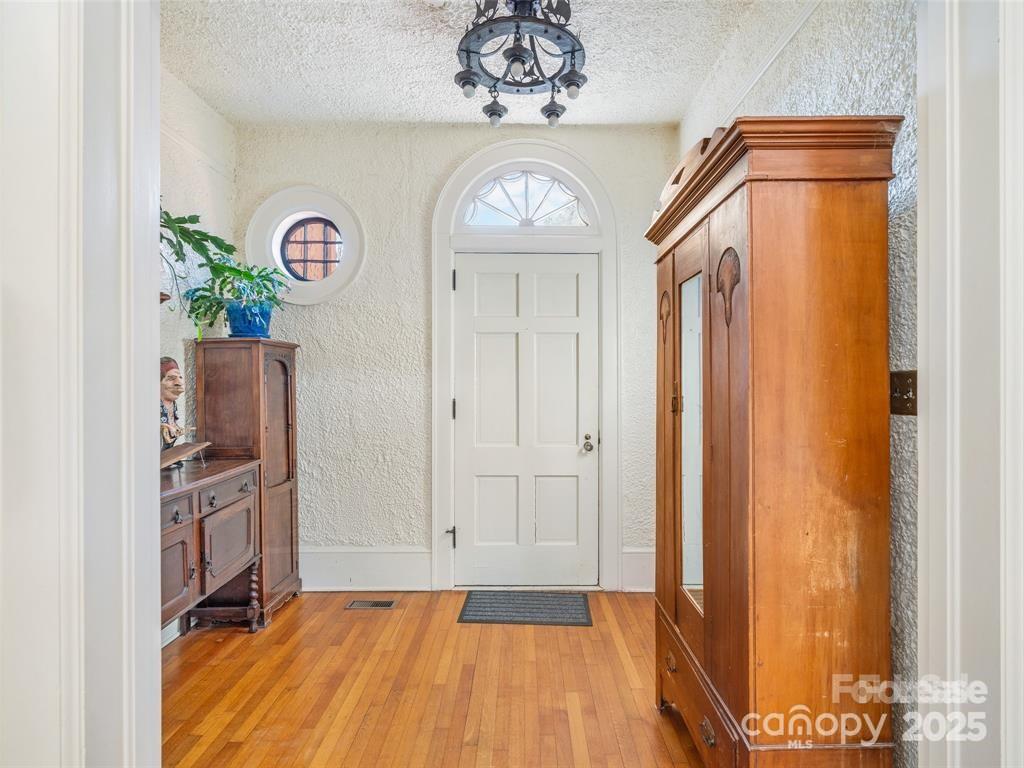 26 Sheridan Road Asheville, NC 28803 - Photo 8 of 46 a view of an entryway with wooden floor
