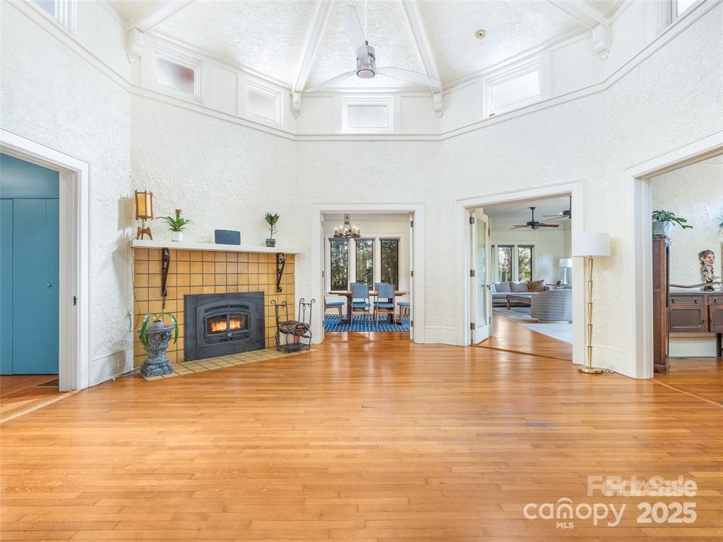 26 Sheridan Road Asheville, NC 28803 - Photo 9 of 46 a view of a livingroom with an empty space and a fireplace