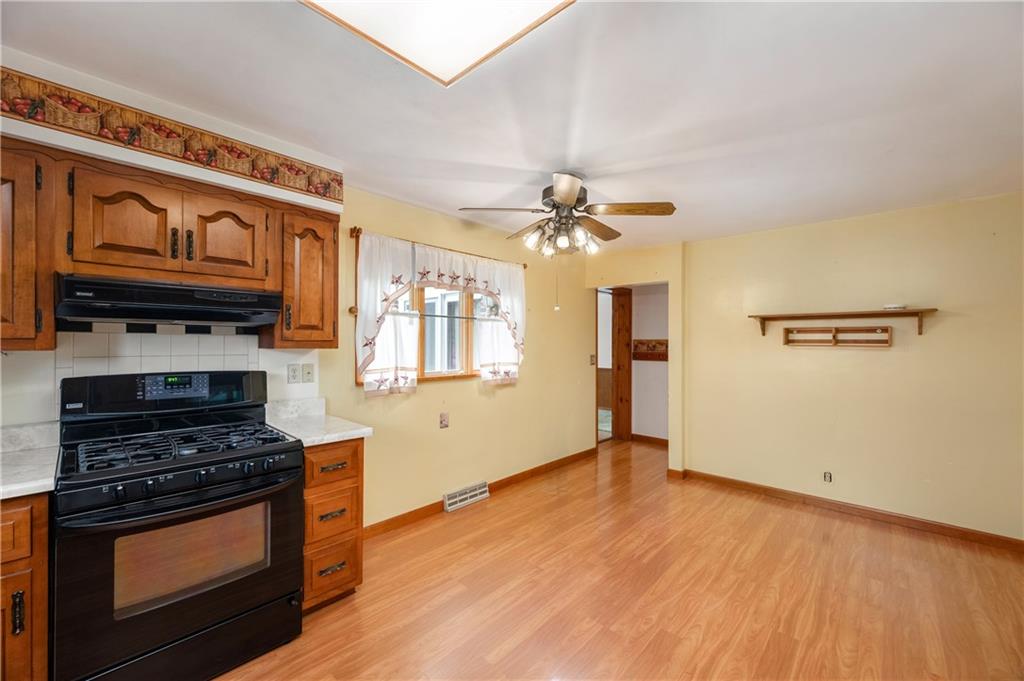 501 Bear Creek Road Sarver, PA 16055 - Photo 12 of 30 a kitchen with stainless steel appliances a stove and a wooden floor