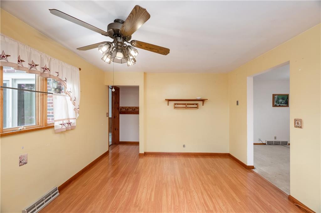 501 Bear Creek Road Sarver, PA 16055 - Photo 13 of 30 a view of a livingroom with wooden floor and a ceiling fan