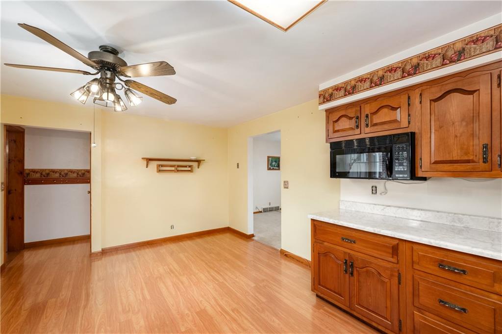 501 Bear Creek Road Sarver, PA 16055 - Photo 14 of 30 a kitchen with stainless steel appliances a sink cabinets and wooden floor