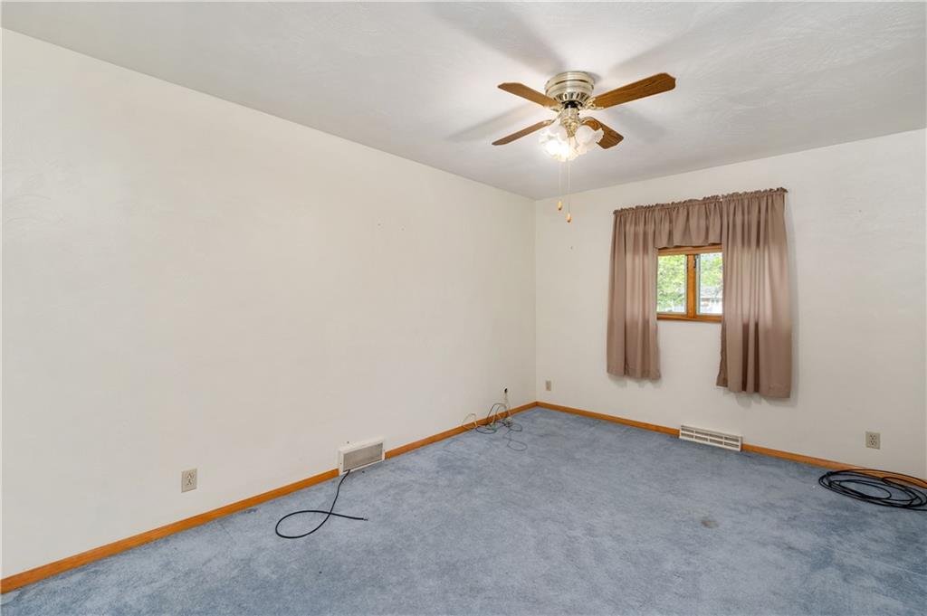501 Bear Creek Road Sarver, PA 16055 - Photo 18 of 30 an empty room with windows and ceiling fan