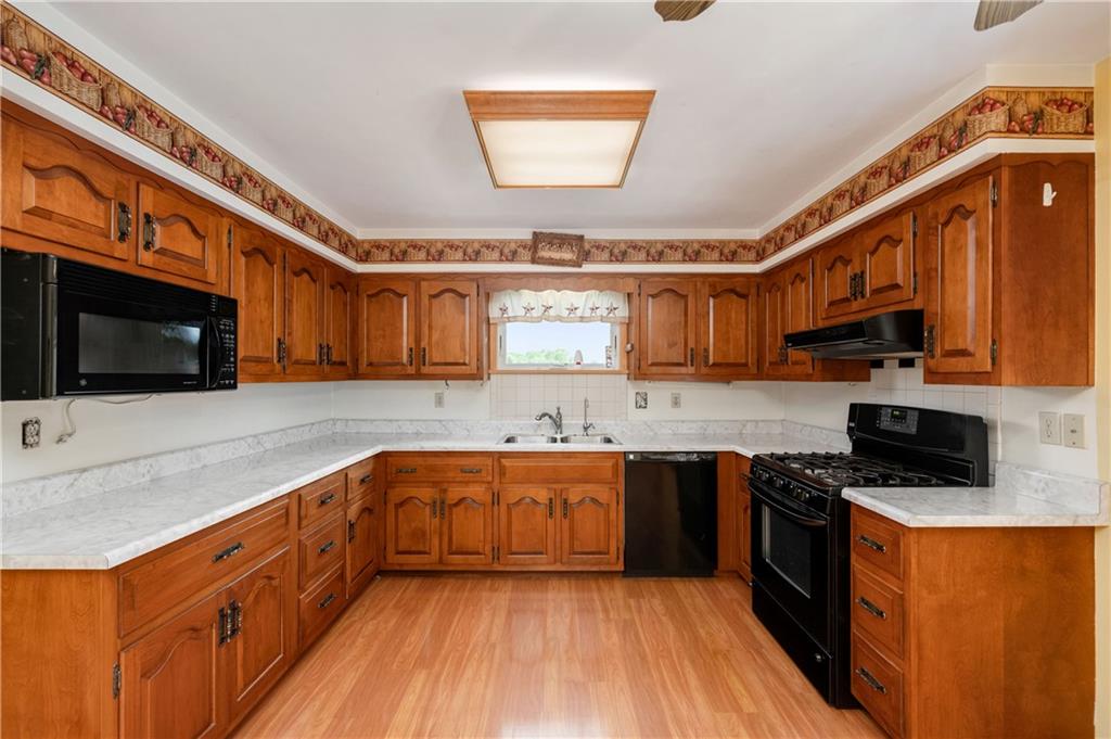 501 Bear Creek Road Sarver, PA 16055 - Photo 10 of 30 a large kitchen with stainless steel appliances granite countertop a stove and a sink
