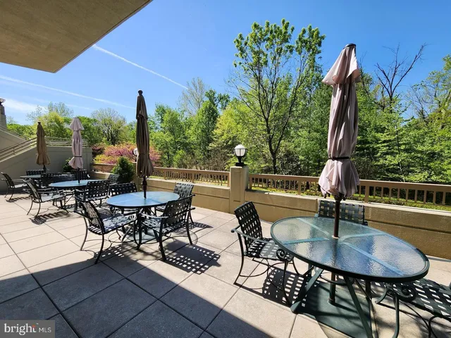 a view of a chairs and table in patio