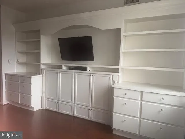 a view of a livingroom with cabinet