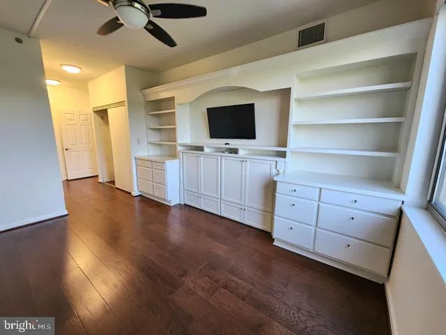 a view of a livingroom with furniture and a flat screen tv