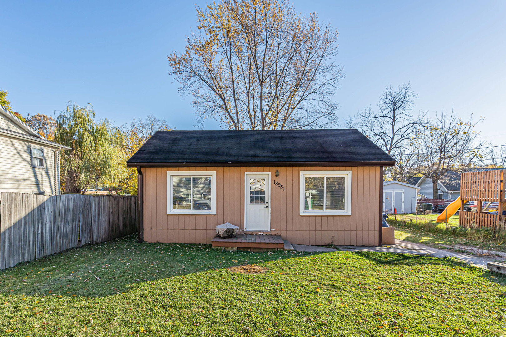 a front view of a house with a yard