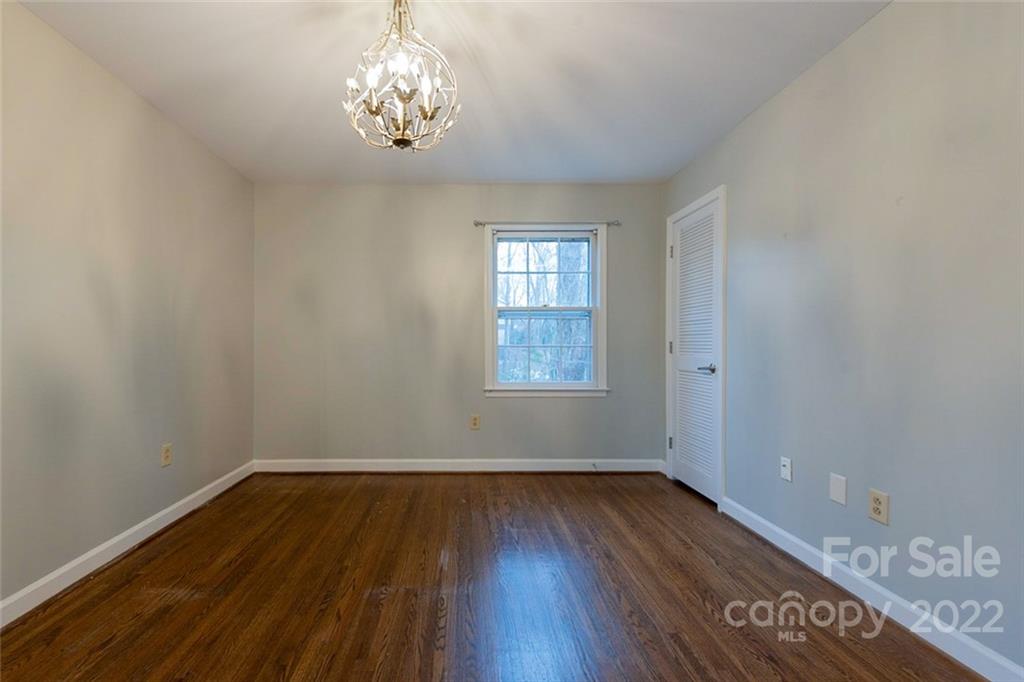 2522 Merrywood Road Charlotte, NC 28210 - Photo 11 of 21 wooden floor in an empty room with a window
