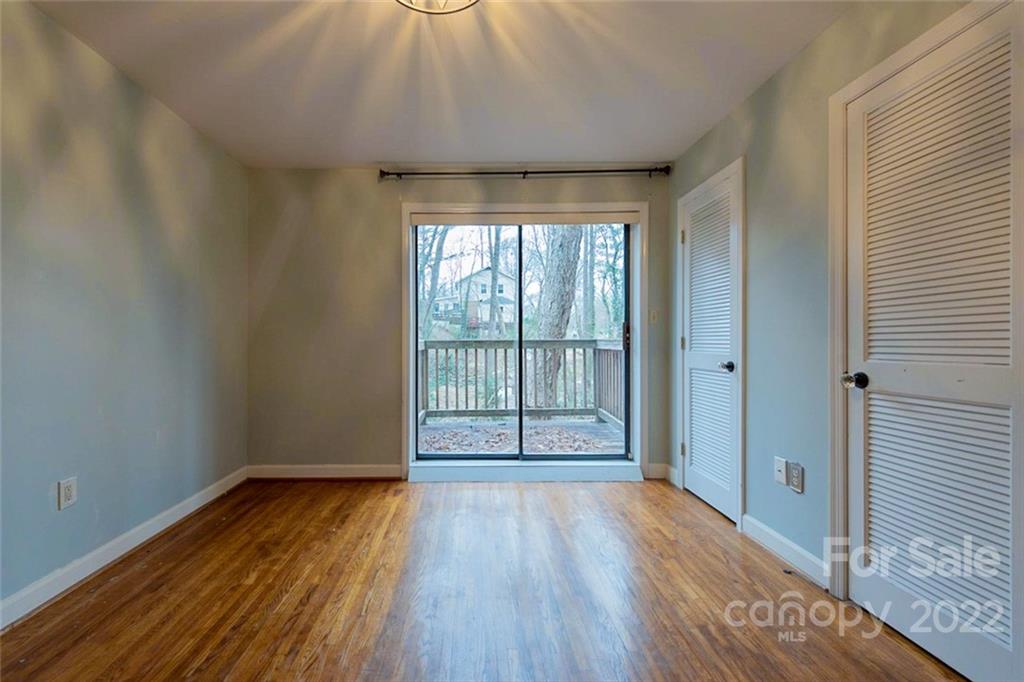 2522 Merrywood Road Charlotte, NC 28210 - Photo 16 of 21 a view of a room with wooden floor and window