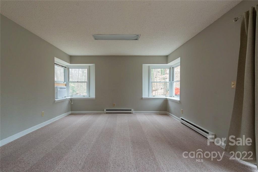 2522 Merrywood Road Charlotte, NC 28210 - Photo 17 of 21 an empty room with windows
