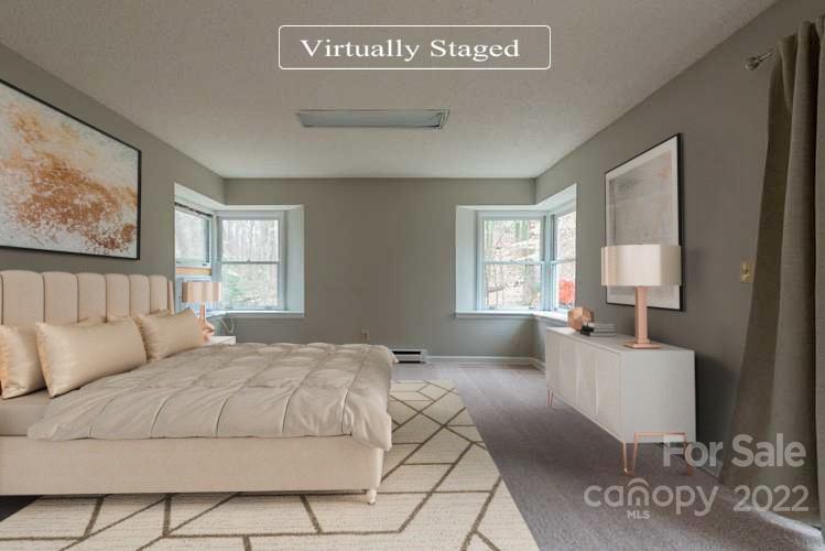2522 Merrywood Road Charlotte, NC 28210 - Photo 3 of 21 a bedroom with a large bed and a couch