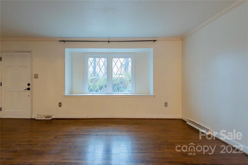 2522 Merrywood Road Charlotte, NC 28210 - Photo 10 of 21 an empty room with wooden floor and windows