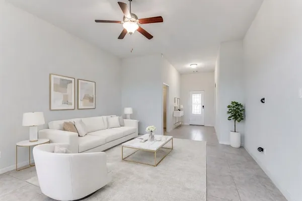 a living room with furniture and a large window