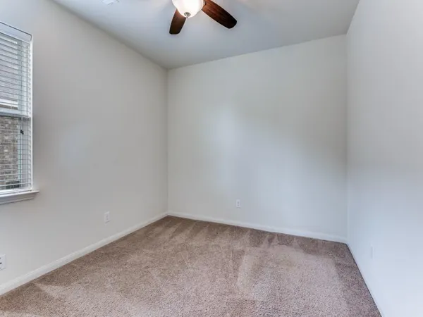 an empty room with a empty space and a window