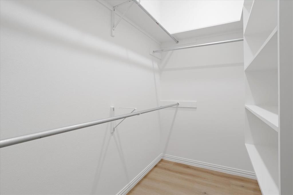 215 East Nelson Street Denison, TX 75021 - Photo 18 of 27 a view of small space with racks on the wall