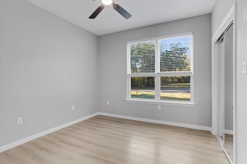 215 East Nelson Street Denison, TX 75021 - Photo 19 of 27 an empty room with a window