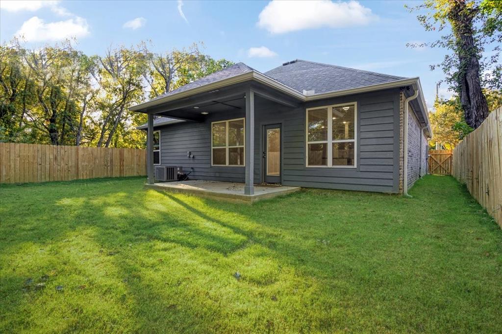 215 East Nelson Street Denison, TX 75021 - Photo 23 of 27 a view of a house with a garden