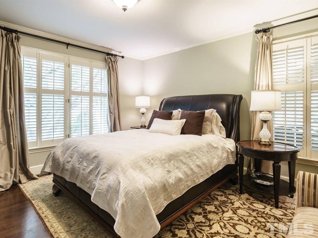 3116 Eton Road Raleigh, NC 27608 - Photo 14 of 25 a bedroom with a bed and a window