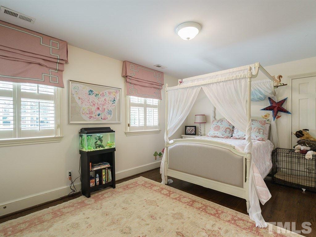 3116 Eton Road Raleigh, NC 27608 - Photo 18 of 25 a bedroom with a bed and a window
